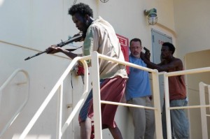Barkhad Abdi, Tom Hanks and Barkhad Abdirahman in Captain Phillips