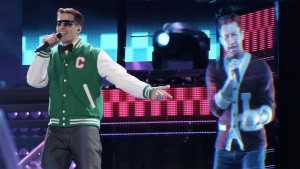 Andy Samberg sings with a hologram of Adam Levine in Popstar: Never Stop Never Stopping
